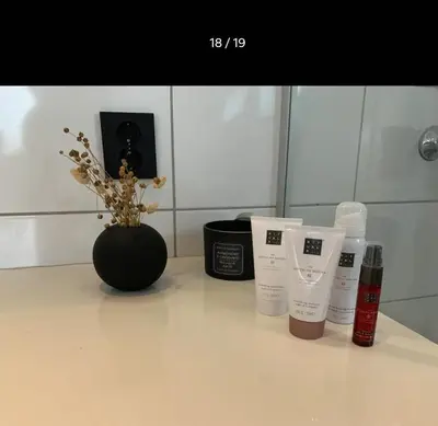 a group of products sitting on a counter with a vase at Villa with jacuzzi in Nord Bjørøy