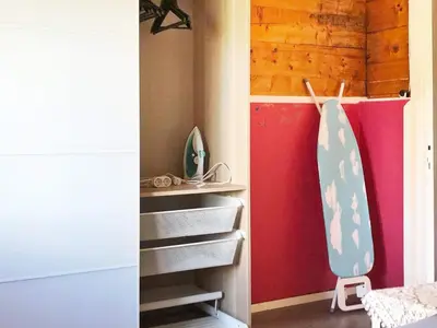a room with a surfboard and stairs in a room at 6 person holiday home in Utvik in Utvik
