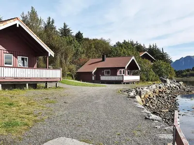 a road leading to two buildings and a house at 6 person holiday home in Bud-By Traum in Bud