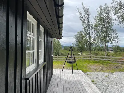 a porch of a house with a sign on it at Sigurdhytta in Ål