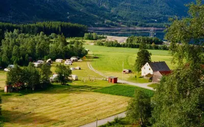 an aerial view of a farm in a field at Seim Camping - Røldal in Røldal