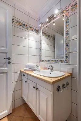 a bathroom with a sink and a mirror at Tinden Apartments in Hemsedal