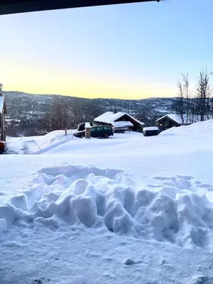 a pile of snow on top of a snow covered field at Geilo - Ny og flott hytte på budalstølen in Geilo