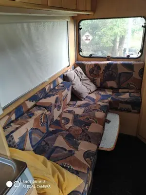 a bed in the back of an rv at Airbnb and Booking at Postvegen 95 in Vigra