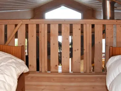 a wooden fence in a bedroom with a window at 6 person holiday home in VATNE-By Traum in Vatne