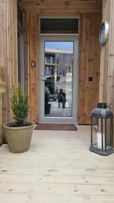 an open door with a potted plant in front of it at Cozy Apartment by the slopes in Kvitfjell Vest in Favang