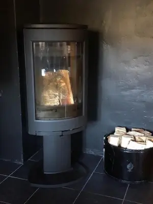 a tv sitting in a room with a fireplace at Uvdalhytta - close to cross country and downhill skiing in Uvdal