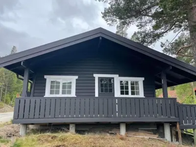 a small black house with a white window at Uvdalhytta - close to cross country and downhill skiing in Uvdal