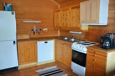 a kitchen with a white stove and a refrigerator at Uvdalhytta - close to cross country and downhill skiing in Uvdal