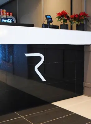 a black and white counter with a white letter on it at Rjukan Hotell in Rjukan