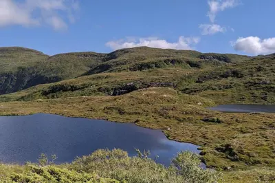 a bunch of hills with two lakes on them at Kråkehaugen Feriehus, a perfect holiday retreat near Åheim in Åheim