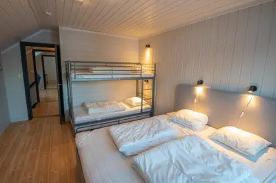 a bedroom with two bunk beds in a room at Bakkebyvegen 22B in Trysil