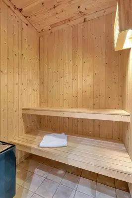 a sauna with wooden walls and wooden shelves at Gaustablikk hytta ski-in ski-out in Gaustablikk