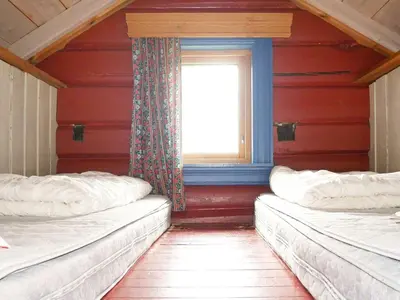 two beds in a room with a window at 5 person holiday home in Hemsedal-By Traum in Hemsedal