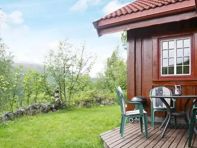 a porch of a house with a table and chairs at 5 person holiday home in Hemsedal-By Traum in Hemsedal
