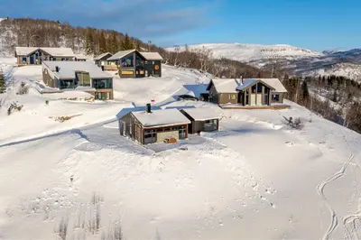 an aerial view of a resort in the snow at Ski in ski out mountain cabin with views and extra unit option in Sogndal