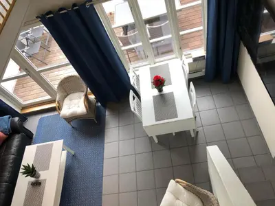 an overhead view of a living room with a table and chairs at Kviltorp Camping in Molde