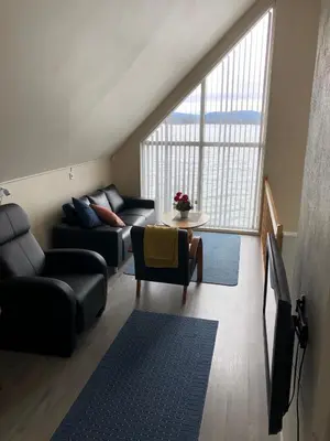 a living room with a couch and a table at Kviltorp Camping in Molde