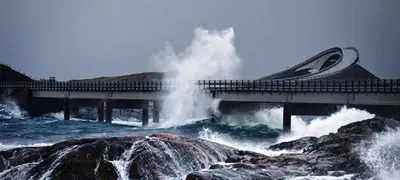 a boat on a bridge over a river with waves at Kviltorp Camping in Molde