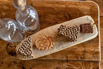 a cutting board with three different types of cookies on it at Ranten Hotell Best Western Signature Collection in Nesbyen