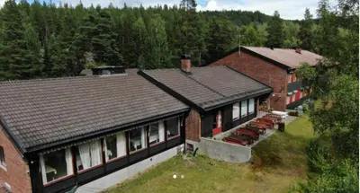 an aerial view of a house with a roof at Fossanåsen Hotel in Flesberg