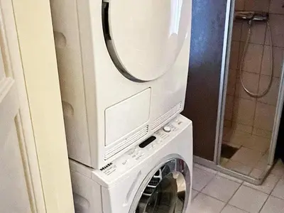 a washing machine with a mirror on top of it at 8 person holiday home in MÅLØY-By Traum in Måløy