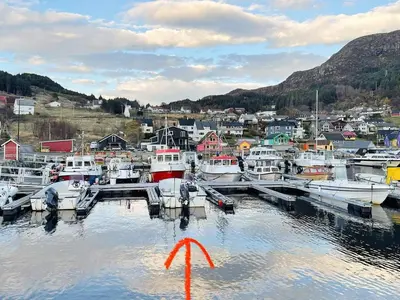 a group of boats docked at a dock in a harbor at 8 person holiday home in MÅLØY-By Traum in Måløy