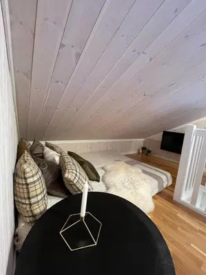 a room with a bed and a table in a room at Skarvebo - cabin with amazing view in Hol