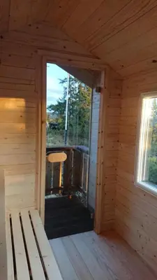 an inside view of a wooden cabin with a porch at Buhaug - cabin at Sjusjøen in Sjusjøen