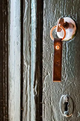 a metal door with a padlock on it at VILLA BRATTHOLMEN in Brattholmen
