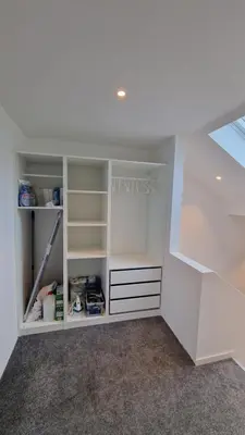 an empty room with white cabinets and shelves at Lovely 2-bedroom loft with panoramic view. in Kristiansund