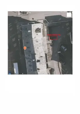 an aerial view of a building with a red circle at Lovely 2-bedroom loft with panoramic view. in Kristiansund