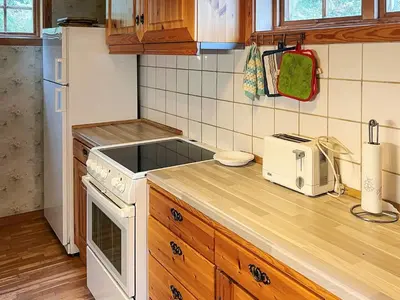 a kitchen with a white stove and a sink at 7 person holiday home in STRYN-By Traum in Stryn