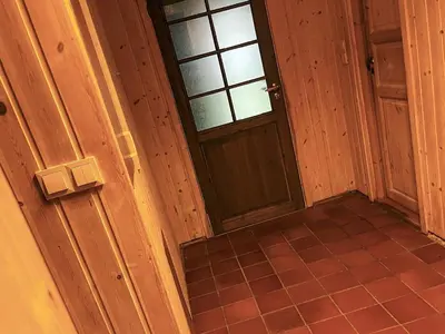 an empty room with a door and a tiled floor at 7 person holiday home in STRYN-By Traum in Stryn