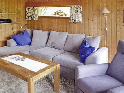 a living room with a couch and two chairs and a table at 6 person holiday home in olden in Olden