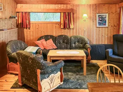 a living room with a couch and a table at 6 person holiday home in olden in Olden