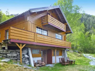 a large wooden house with a balcony on top at 2 person holiday home in STRYN-By Traum in Stryn