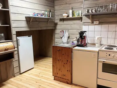 a kitchen with a white refrigerator and a counter top at 2 person holiday home in STRYN-By Traum in Stryn