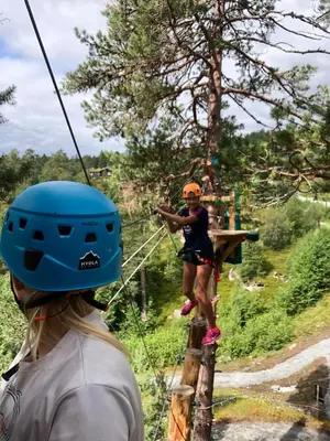 a group of people on a zip line at Fagre Stryn Feriehus in Stryn