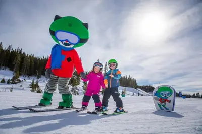 a group of three children on skis in the snow at Beautiful penthouse with panoramic view at Sjusjøen in Ringsaker