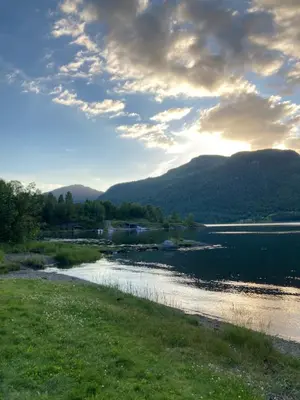 a view of a river with mountains in the background at Havn i Etne with fjordview in Etnesjøen