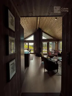 a living room with a pool table and chairs at Unique cabin with fantastic lake view, sauna, ski & EV outlet in Svingvoll