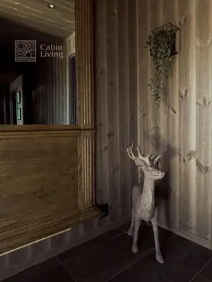a statue of a deer in the corner of a building at Unique cabin with fantastic lake view, sauna, ski & EV outlet in Svingvoll