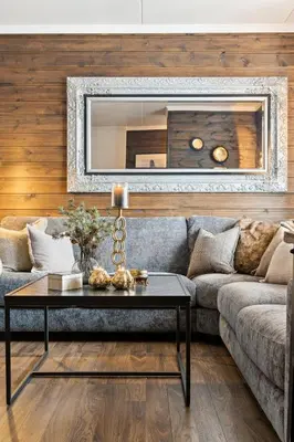 a living room with a couch and a table at Nice apartment with Sauna and ski in out Trysil in Trysil