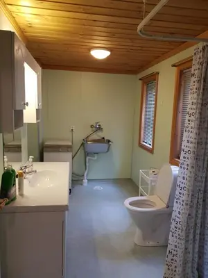 a bathroom with a toilet and a sink at Hatlen View in Isfjorden