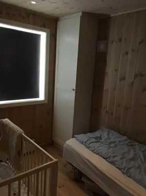 a small bedroom with a bed and a window at Holiday cottage with 4 bedroom on 145m² in Sogndal in Sogndal