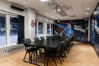 a conference room with a black table and chairs at Scandic Lerkendal in Trondheim