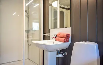 a bathroom with a sink and a shower at Lovely Apartment In Hebnes in Hebnes