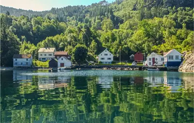 a small village on the shore of a lake at Lovely Apartment In Hebnes in Hebnes