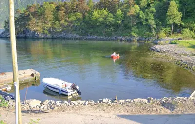 a couple of boats in a body of water at Sjøhytta in Vanvik